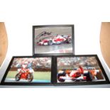 A framed and signed photograph bearing the signature of Michael Schumacher, together with a framed
