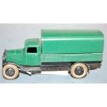 A Dinky Toys No. 25B covered wagon comprising green and black body with black hubs and white