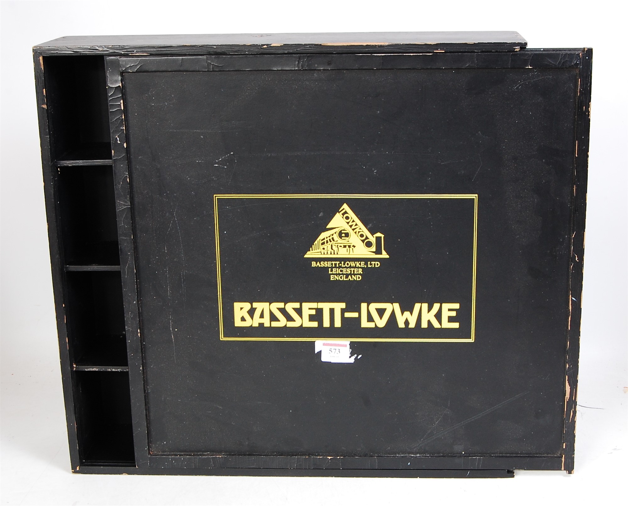 Home made wooden box painted black, stencilled yellow "Bassett Lowke" to take four bogie coaches (