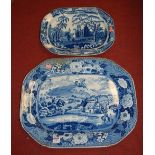 A large 19th century blue & white meat plate transfer decorated with figures beside a mill within