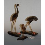 A set of three carved horn figures of birds, largest 33cm