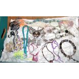 A box of miscellaneous costume jewellery to include various beaded necklaces, paste set necklaces