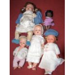 Two boxes of various childrens dolls to include bisque headed 'Nunsuch' N&S Liverpool example