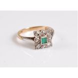 An early 20th century 18ct and platinum emerald and diamond ring, the central square emerald in