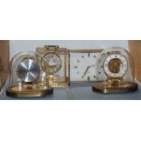 A Kundo electronic brass cased mantel clock together with three others (4)