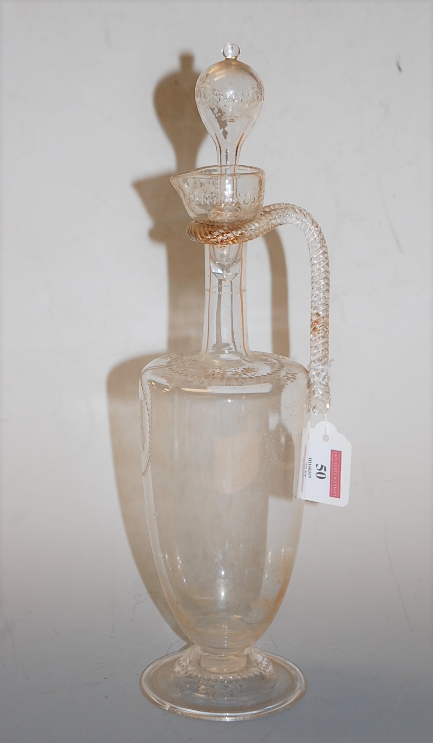 A 19th century etched glass ewer and stopper having a spirally twist angular handle to tapered