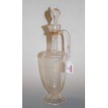 A 19th century etched glass ewer and stopper having a spirally twist angular handle to tapered