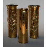 A pair of World War One trench art shell case vases, each having embossed oak leaf and acorn