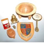 A collection of miscellaneous items, to include various military shield shaped wall plaques,
