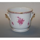 A Herend porcelain cache-pot, painted with pink flowers and heightened in gilt, having printed