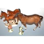 A Beswick figure of a horse, brown gloss finish, together with two Beswick birds Nos. 980 and 992,
