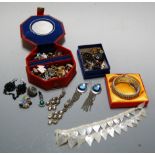 A box of miscellaneous costume jewellery to include enamelled stick pin, white metal drop pendant
