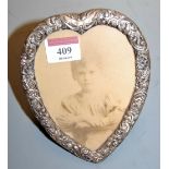 A circa 1900 silver clad heart shaped easel photograph frame, h.15.5cm