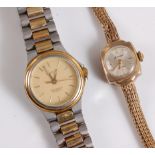 A lady's 9ct Accurist wristwatch, with round dial in squared 9ct case, with 9ct strap, (12g),