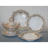 A 19th century Rockingham style part dinner service, on a grey and white ground with gilt floral