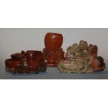 A Chinese soapstone sculpture carved as various flowers together with two others (3)
