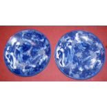 A pair of Japanese late Meiji period blue & white chargers each decorated with flowers and