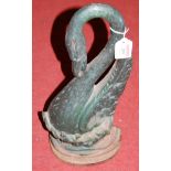 A large painted cast iron doorstop in the form of a swan
