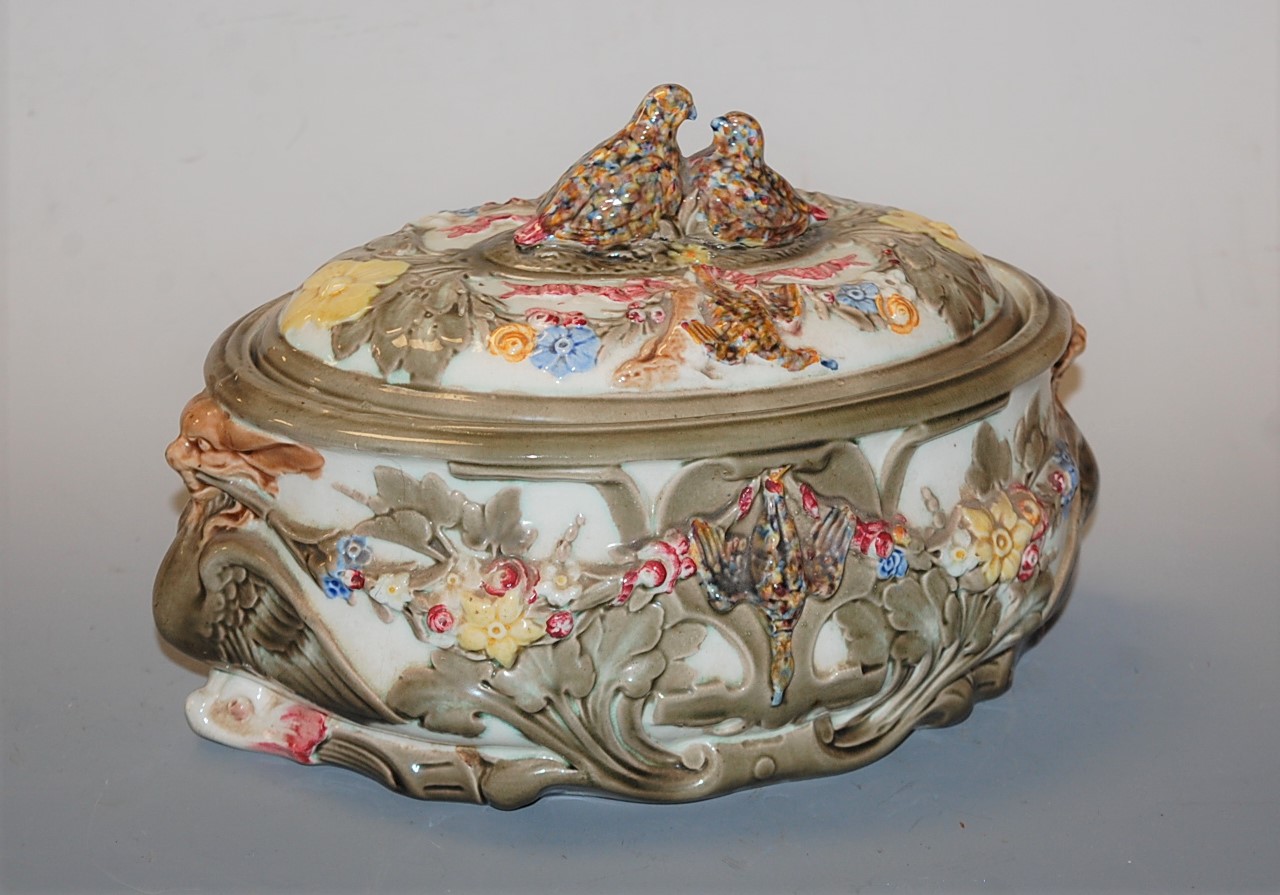 A Victorian Wedgwood majolica glazed game pie tureen and cover, the finial moulded as nesting birds,