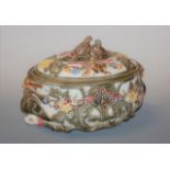 A Victorian Wedgwood majolica glazed game pie tureen and cover, the finial moulded as nesting birds,