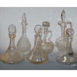 A collection of cut glassware to include ships decanter and stopper, etched with coat of arms having
