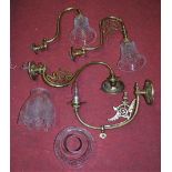 Four various lacquered brass single sconce wall light fittings, two with cut glass bell shaped