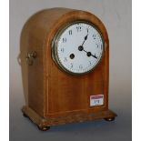 An Edwardian mahogany and boxwood strung dome top mantel clock having a convex enamel dial with