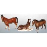 A Beswick foal, gloss finish; one other similar example possibly by Beswick; and a Lomonosov Russian