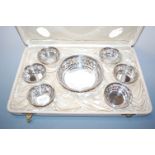 An early 20th century sterling silver bonbon set, having a central pierced circular bowl within