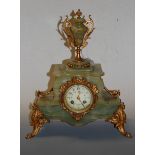 A 19th century onyx cased and gilt metal mounted mantel clock having painted enamel dial with Arabic