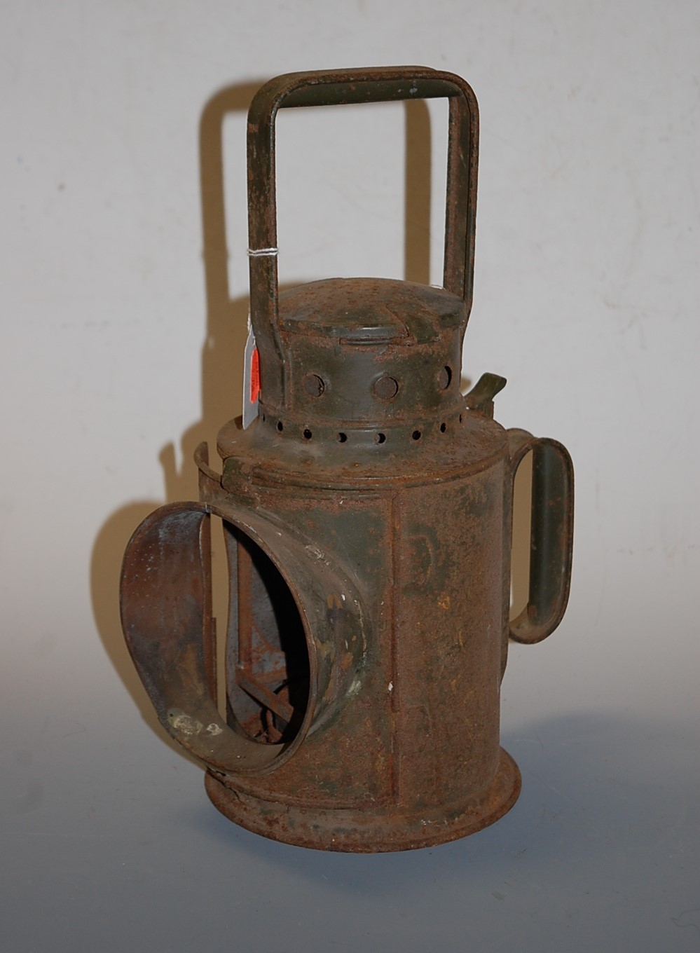 An early 20th century green painted railway hand lantern