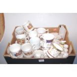 A quantity of china commemorative mugs, a beaker, assorted crested cabinet china to include