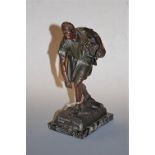 After Jean Tarritt, a bronzed spelter figure of a man in standing pose with bag upon his back