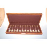 A cased set of twelve modern silver and silver gilt commemorative spoons for the RSPB, the terminals