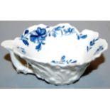 An 18th century Worcester blue and white butter boat, having typical underglaze blue floral