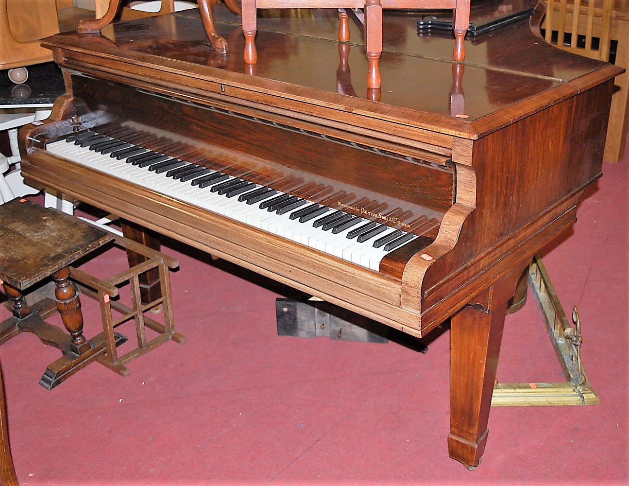 An early 20th century rosewood cased baby grand piano by Collard & Collard, iron-framed and over-
