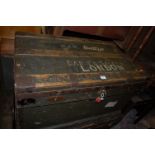 An early 20th century stained pine and metal bound hinge top military travelling trunk, having