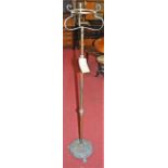 An Art Nouveau copper and brass paraffin lamp stand, with telescopic action (lacking burner)