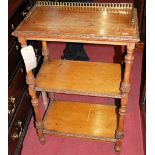 A late 19th century floral relief carved oak three-tier etagere, having a pierced brass three-