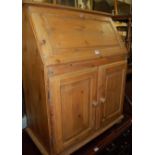 A modern pine slopefront two door writing bureau, width 80.5cm