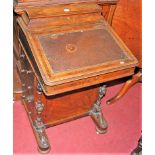 A mid-Victorian figured walnut and inlaid slopefront Davenport, having hinged stationery compartment