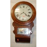 A Victorian mahogany circular drop trunk wall clock, the white enamel dial with lozenge shape