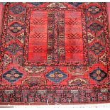 A Persian style red ground woollen Bokhara rug, 165x85cm; together with a contemporary European