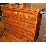 A contemporary yew wood low chest of four long drawers, width 63.5cm