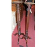 An early 20th century mahogany torchere stand, having an acanthus leaf carved and reeded column,