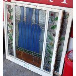 A pair of early 20th century white painted pine and coloured lead glazed inset sash window panels,