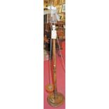 An early 20th century turned beech standard lamp; together with a 1960s chromed metal and teak