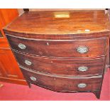 An early 19th century mahogany and crossbanded bowfront chest of three long drawers, w.90cm