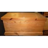 A modern pine hinge top tool chest with iron end carry handles, width 95.5cm