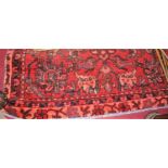 A Persian woollen red ground Tabriz rug, 196x128cm